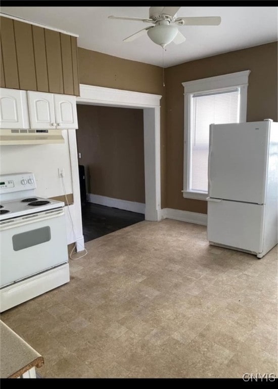 kitchen featuring white appliances, ceiling fan, exhaust hood, and white cabinets