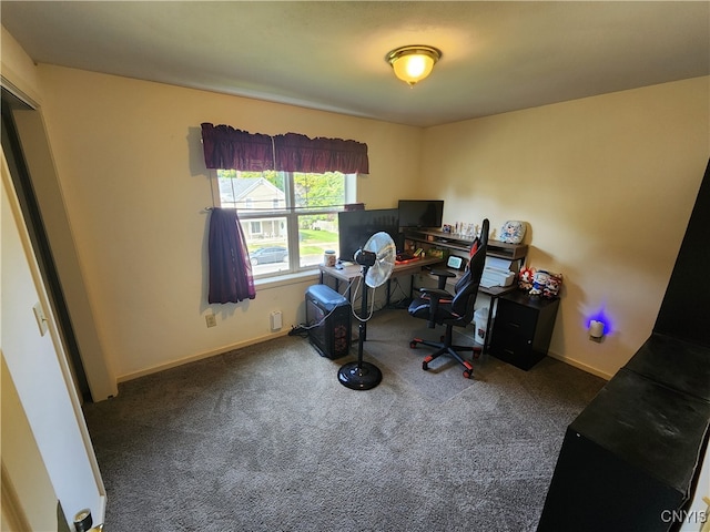 office space with dark colored carpet