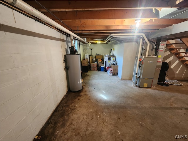 basement with water heater and heating unit