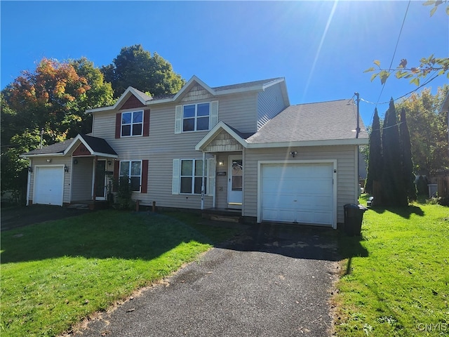 view of front of house featuring a garage and a front yard