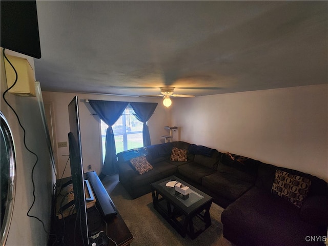 carpeted living room featuring ceiling fan