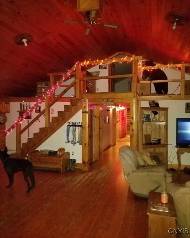 living room featuring wooden ceiling, lofted ceiling, ceiling fan, and hardwood / wood-style flooring