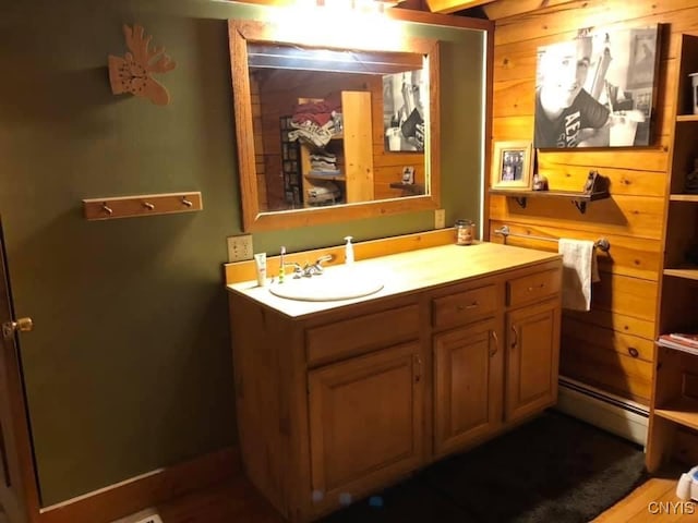 bathroom with a baseboard radiator and vanity