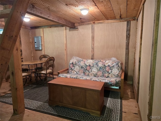 basement featuring wood ceiling and electric panel