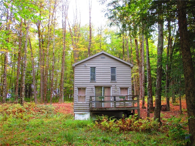 rear view of property with a wooden deck