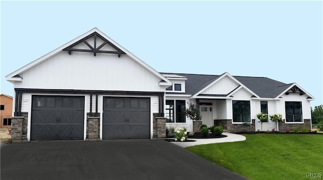 view of front of property with a garage and a front lawn