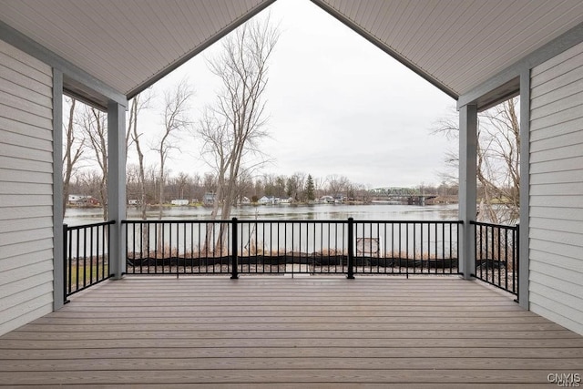 wooden deck featuring a water view