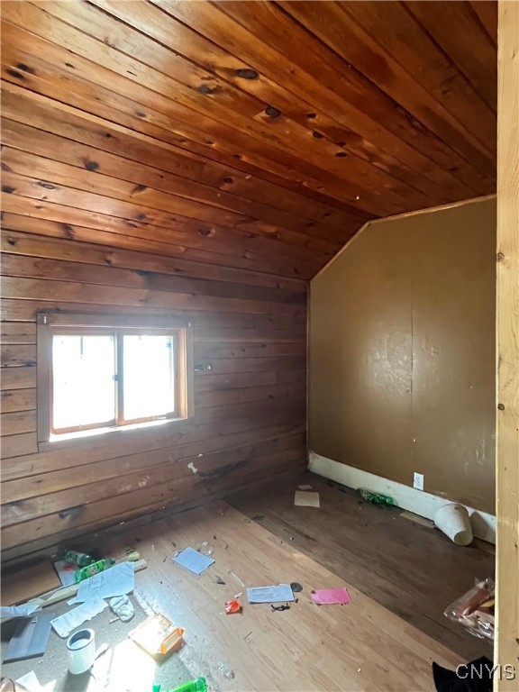 bonus room with wood-type flooring, lofted ceiling, and wood ceiling