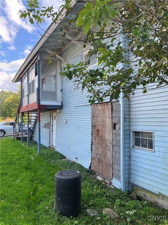 view of home's exterior featuring a yard