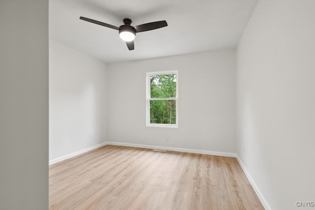 spare room featuring light hardwood / wood-style floors and ceiling fan