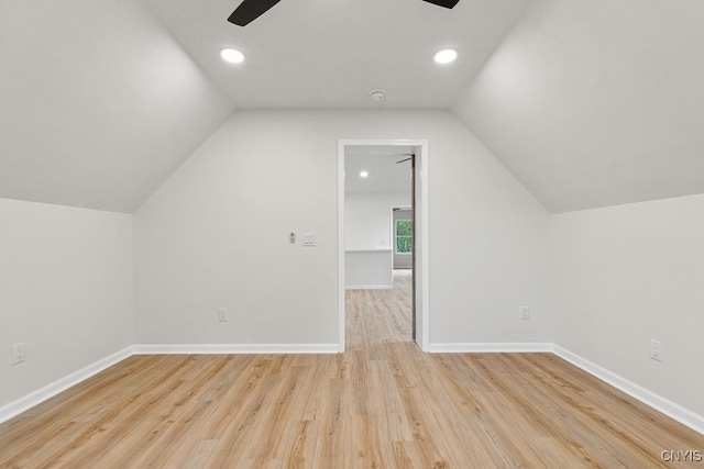 bonus room featuring light hardwood / wood-style floors, vaulted ceiling, and ceiling fan