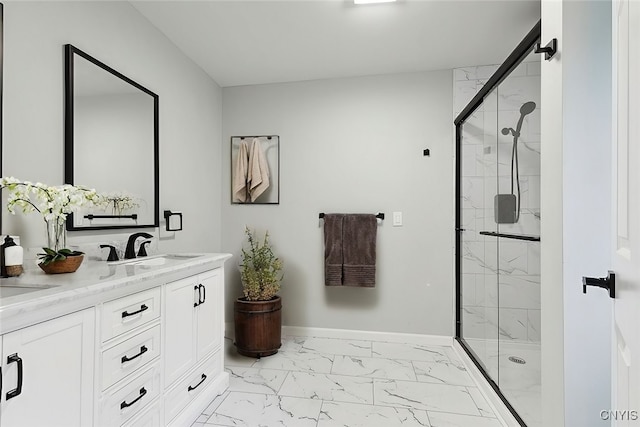 bathroom with a shower with door and vanity