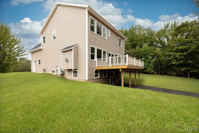 rear view of property with a yard, ac unit, and a deck