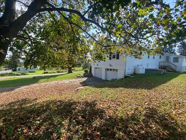 view of yard featuring a garage