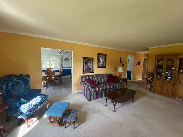 carpeted living room featuring ceiling fan and crown molding