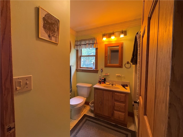 bathroom featuring ornamental molding, tile patterned flooring, vanity, and toilet