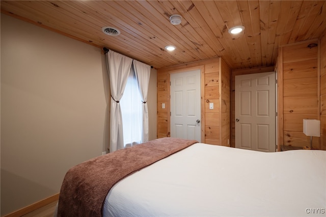 bedroom featuring wood ceiling and hardwood / wood-style flooring