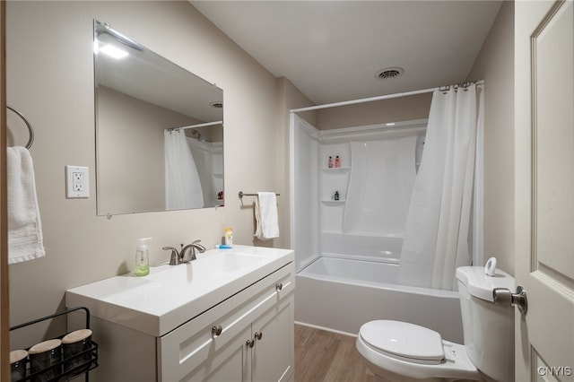 full bathroom featuring hardwood / wood-style floors, vanity, toilet, and shower / bath combo with shower curtain