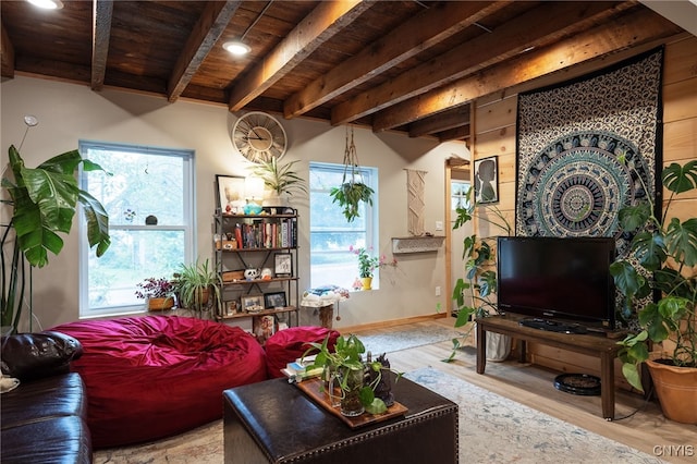 living room with wood ceiling, beamed ceiling, and light hardwood / wood-style flooring