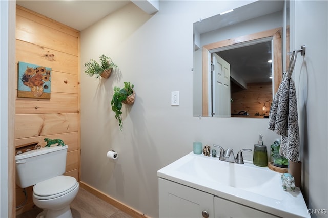 bathroom featuring hardwood / wood-style floors, vanity, and toilet