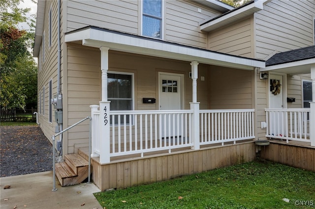 property entrance with covered porch