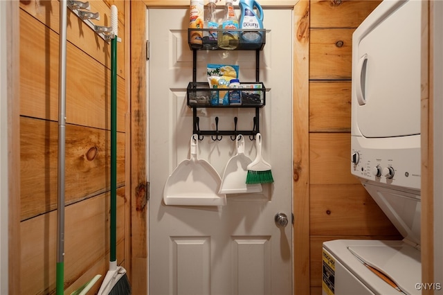 interior space with stacked washer and clothes dryer