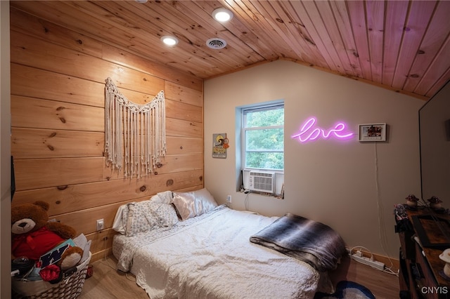 bedroom with wooden ceiling, lofted ceiling, and hardwood / wood-style flooring