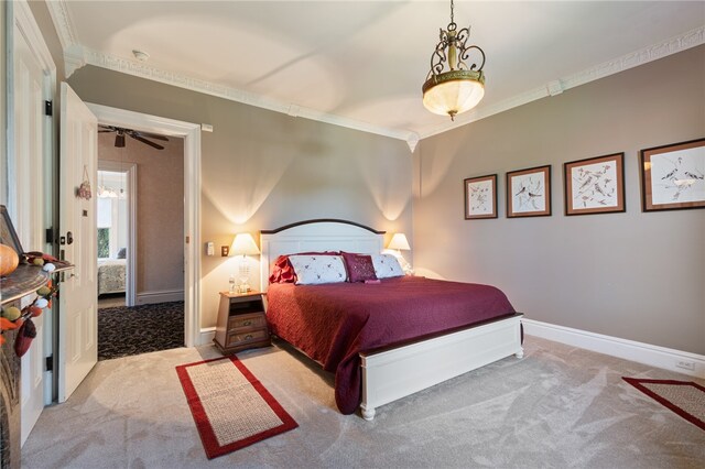 carpeted bedroom with crown molding