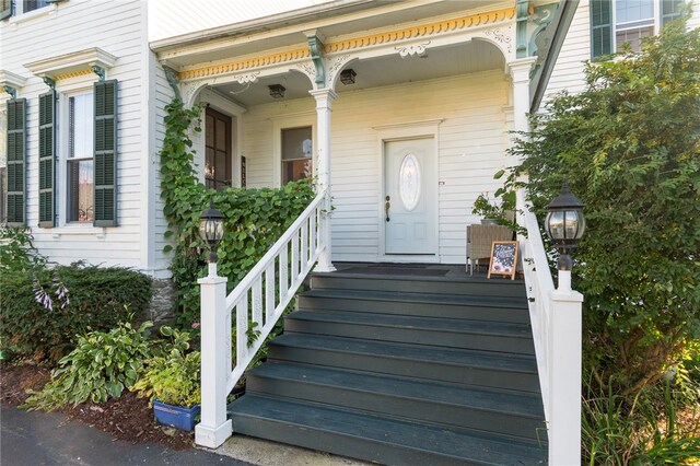 property entrance with covered porch