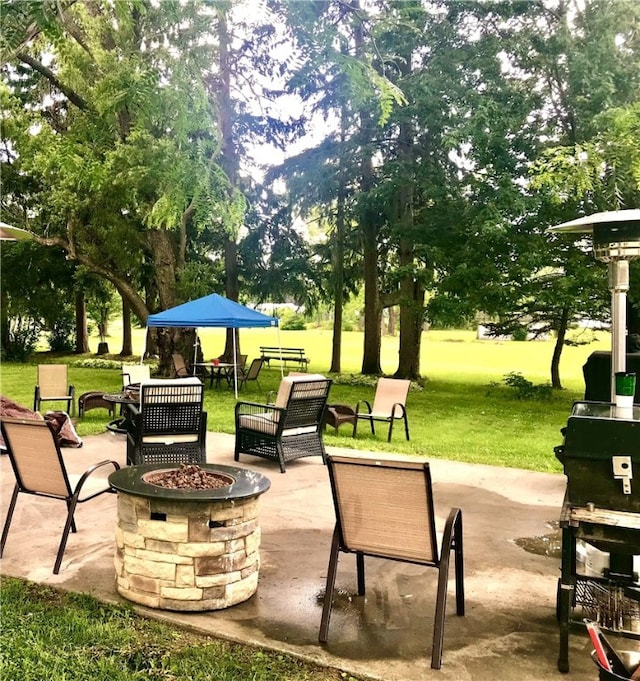 view of patio / terrace with a fire pit