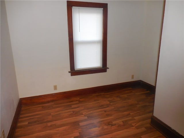 unfurnished room featuring dark hardwood / wood-style floors