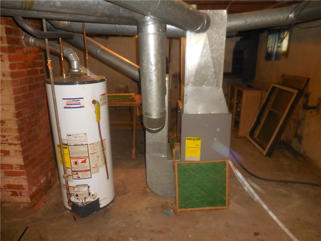 utility room featuring water heater and heating unit