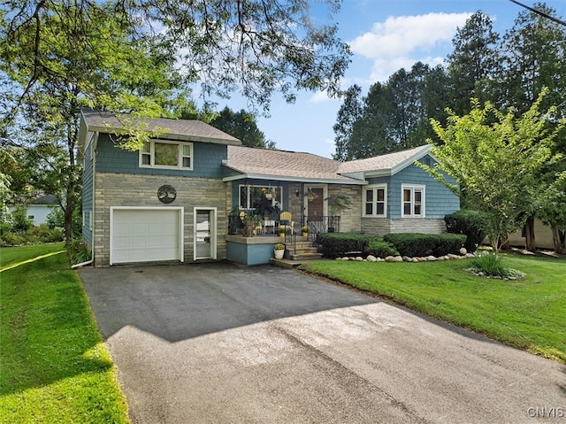 tri-level home featuring a garage and a front lawn