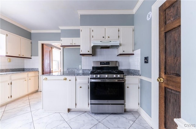 kitchen featuring crown molding, decorative backsplash, dark stone countertops, and stainless steel range with gas cooktop