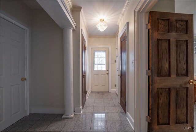 doorway with ornamental molding and decorative columns