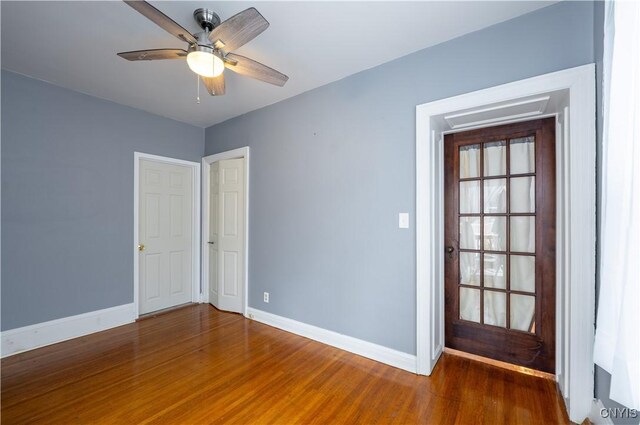 spare room featuring ceiling fan and hardwood / wood-style floors