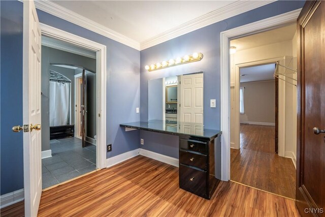 bathroom featuring crown molding and hardwood / wood-style floors