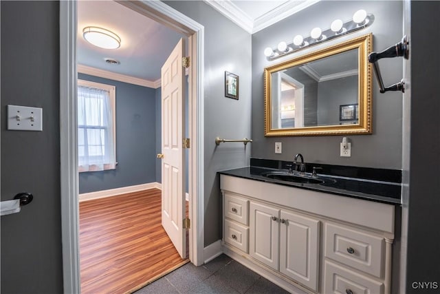 bathroom with vanity and ornamental molding