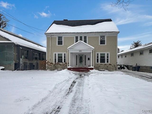 view of front of property featuring cooling unit