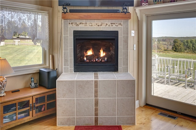 interior details featuring a fireplace and hardwood / wood-style floors