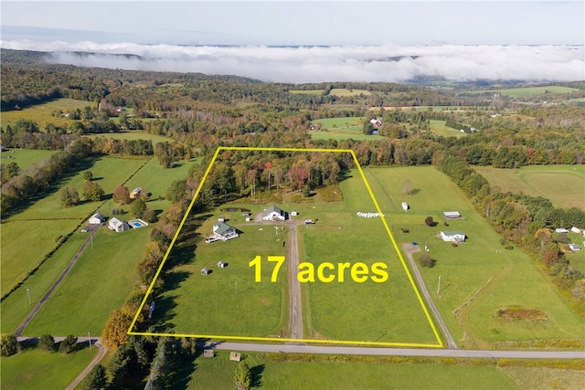 birds eye view of property featuring a rural view