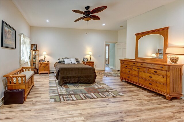 bedroom with ceiling fan and light hardwood / wood-style flooring