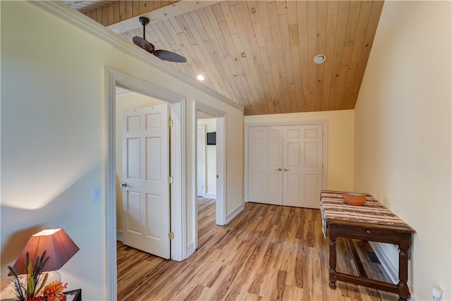 hall featuring light hardwood / wood-style flooring, wood ceiling, and vaulted ceiling with beams