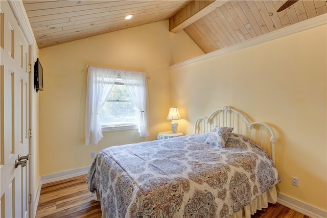 bedroom with wood ceiling, lofted ceiling with beams, and hardwood / wood-style flooring