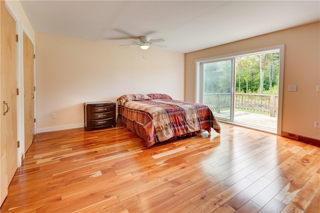 bedroom with ceiling fan, access to exterior, and light hardwood / wood-style floors