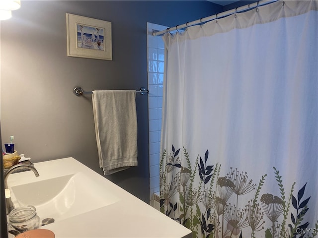 bathroom with sink and a shower with curtain