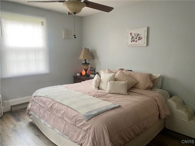 bedroom with wood-type flooring and ceiling fan