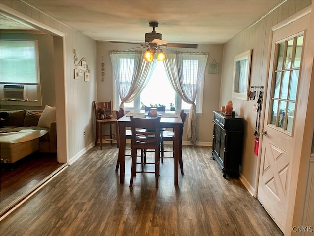 dining space with cooling unit, dark hardwood / wood-style floors, and ceiling fan