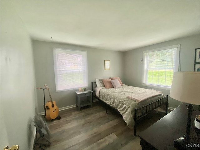 bedroom with hardwood / wood-style flooring