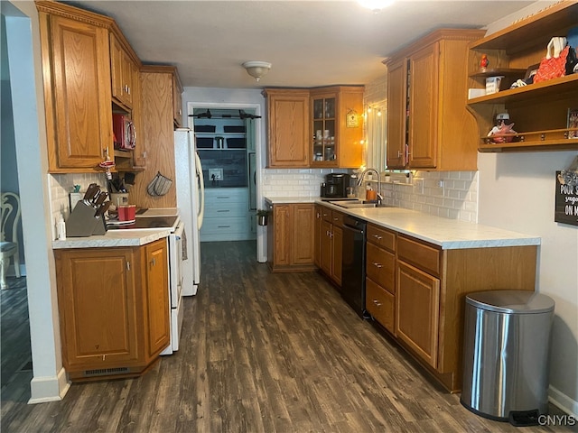 kitchen featuring dark hardwood / wood-style floors, backsplash, white appliances, and sink